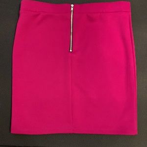Hot pink skirt with trendy outer zipper on back. No tags. Probably a small.